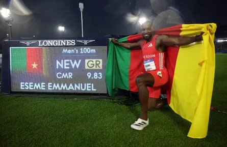 Emmanuel Eseme celebrates after winning the men’s Commonwealth Games 100m final.